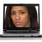 woman's face on laptop screen