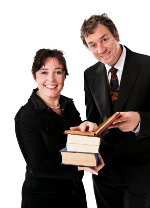 man and woman reviewing a book